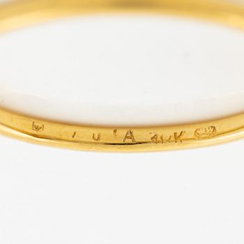Ring in 18K gold with an oval faceted garnet and a brilliant-cut diamond.