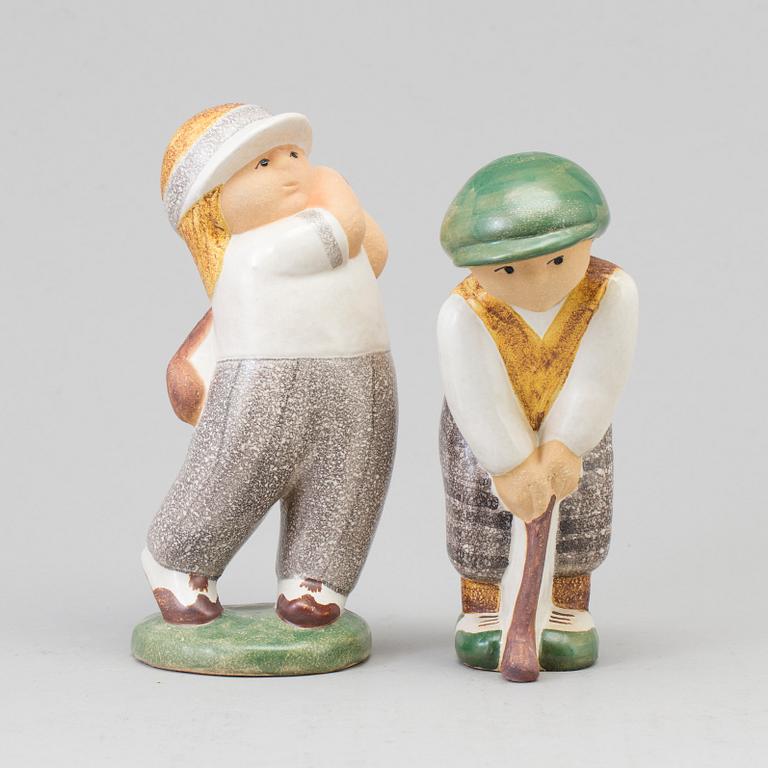 LISA LARSON, a pair of golfer stoneware figurines from Gustavsberg.