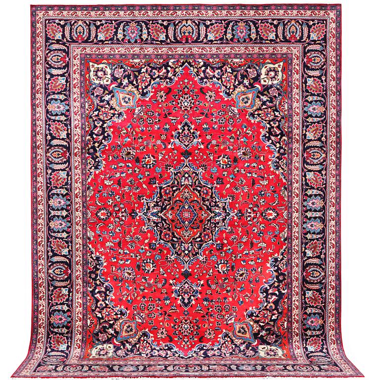 A Kashan carpet, signed, c. 358 x 244 cm.