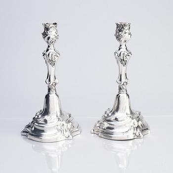A pair of Swedish Rococo silver candlesticks, marks of Abraham Lundberg, Stockholm 1765.