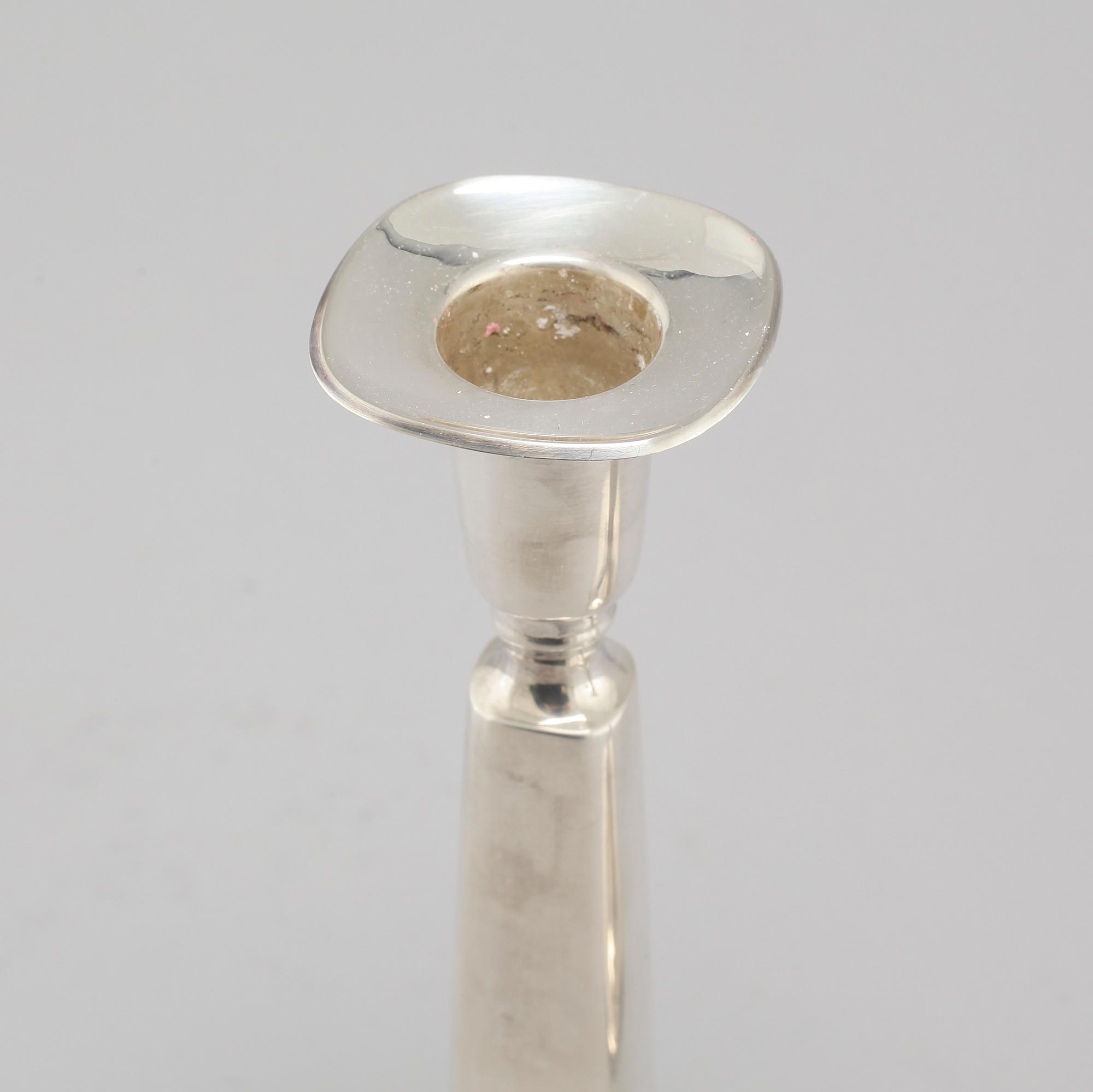 A pair of silver candlesticjs by Tore Eldh for K&EC in Gotheburg, 1970.