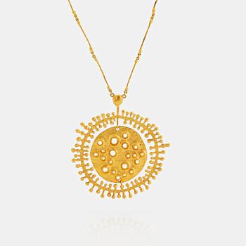 1030. A Tapio Wirkkala pendant "Moon landscape" in 18K gold.