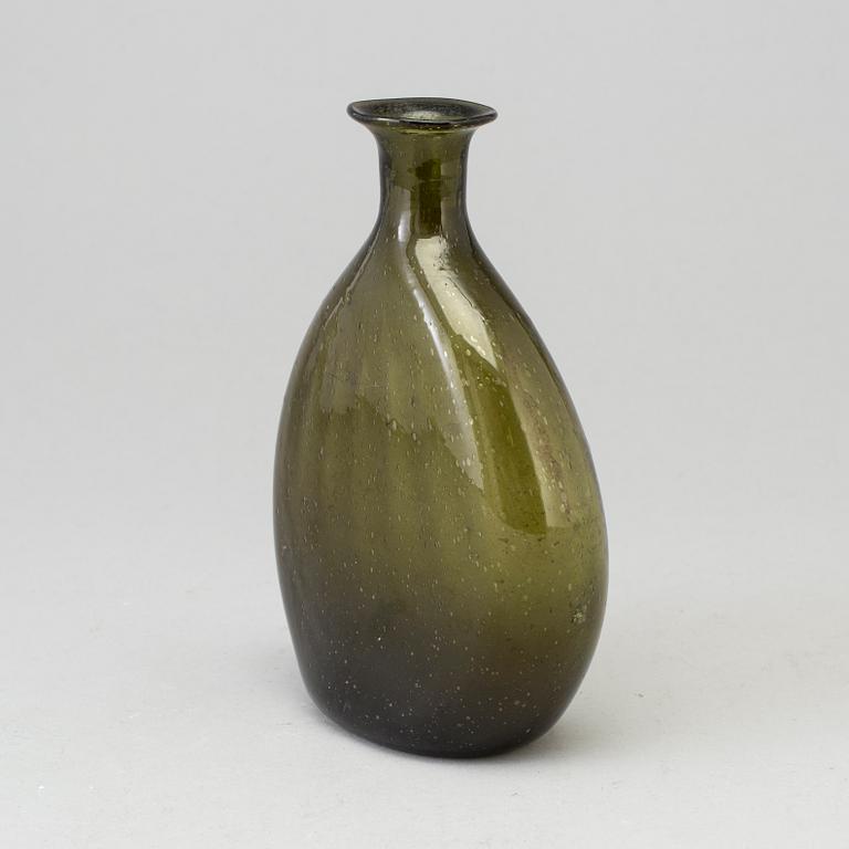 A 18th century glass bottle.