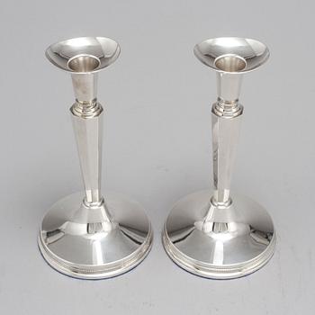 A pair of silver candle sticks by Eric Löfman, Uppsala 1961.