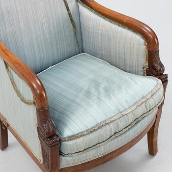 An Empire style mahogany easy chair, early 19th Century.