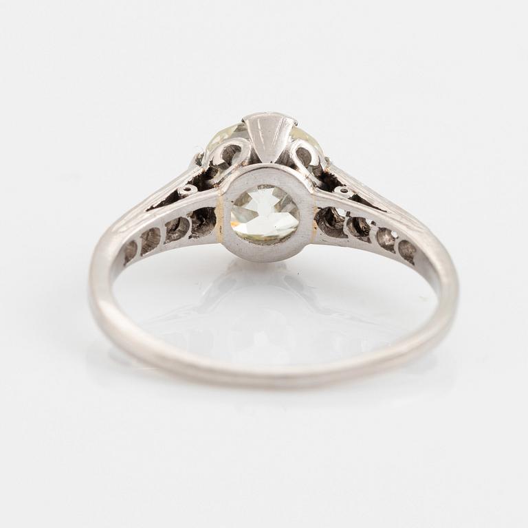 A platinum ring set with a cushion-formed old-cut diamond.