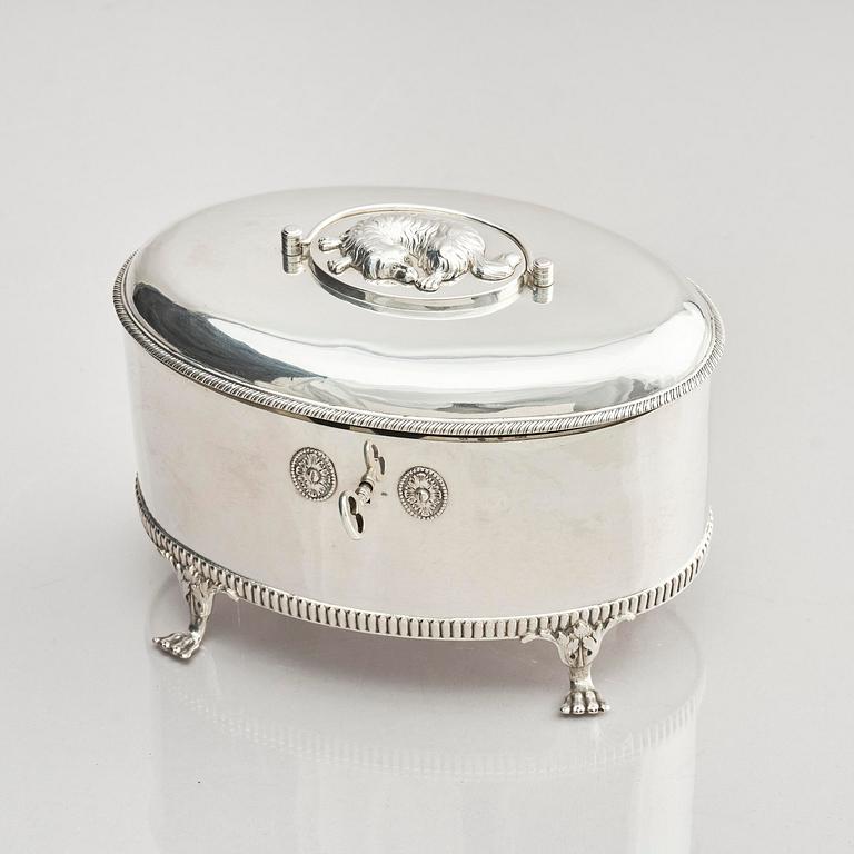 A Swedish 19th century silver sugar-casket and tong, marks of Adolf Zethelius, Stockholm 1819.