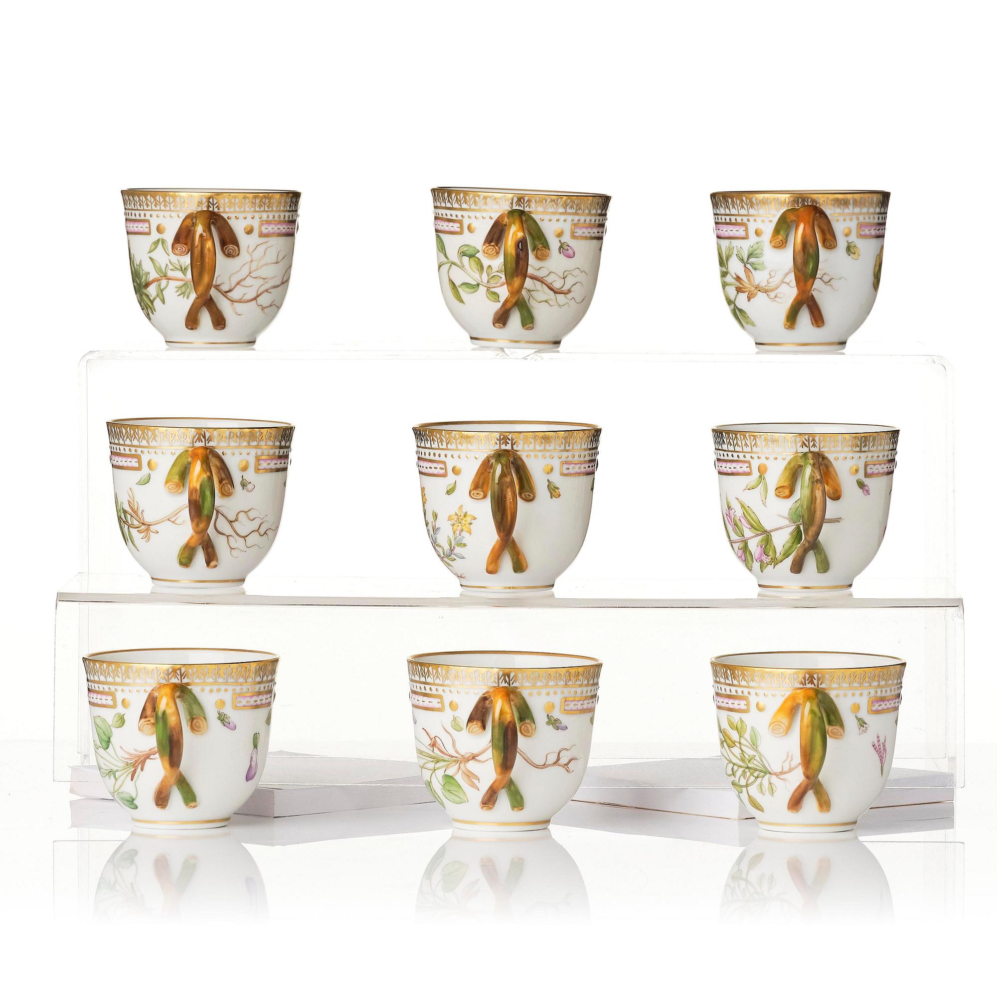 A set of nine Royal Copenhagen 'Flora Danica' cups with saucers, Denmark, 20th century.