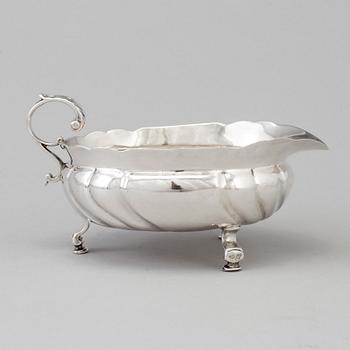 999. A Swedish mid 18th century silver cream-jug, marks of Kilian Kelson, Stockholm 1753.