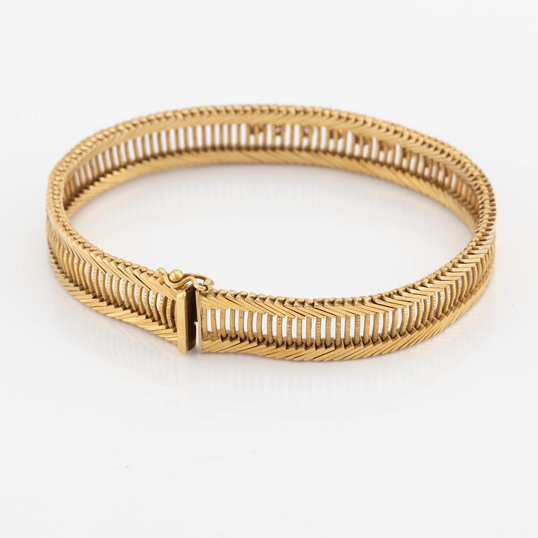 Armband 18K guld med rosa stenar.