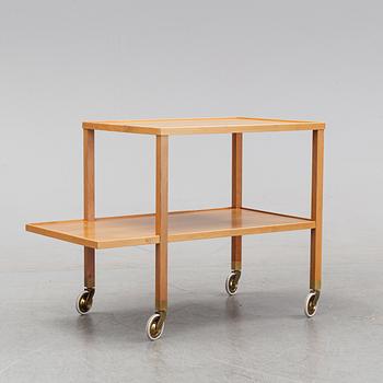 A walnut drink cart designed by Josef Frank for Firma Svenskt Tenn.