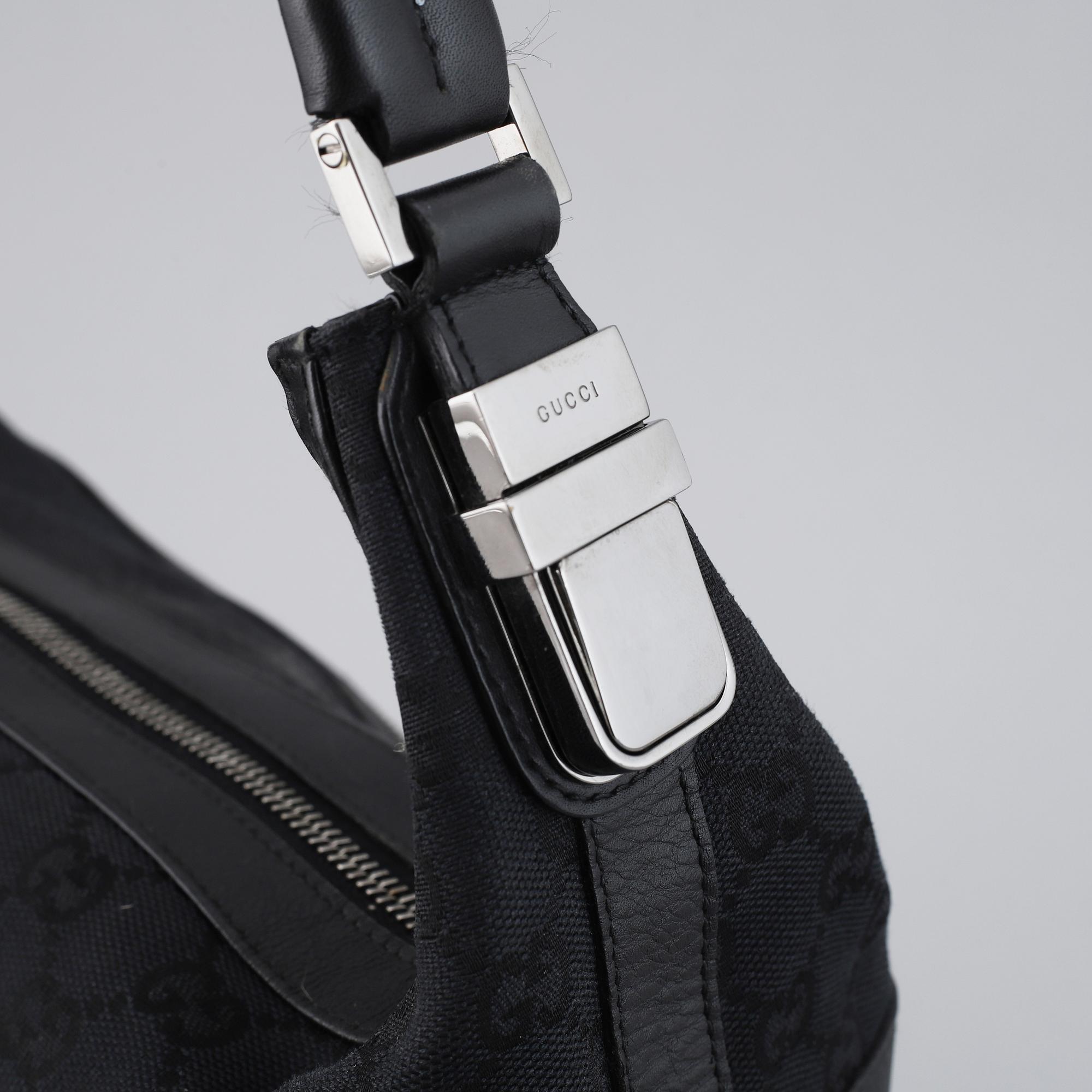 GUCCI, a canvas and leather bag.