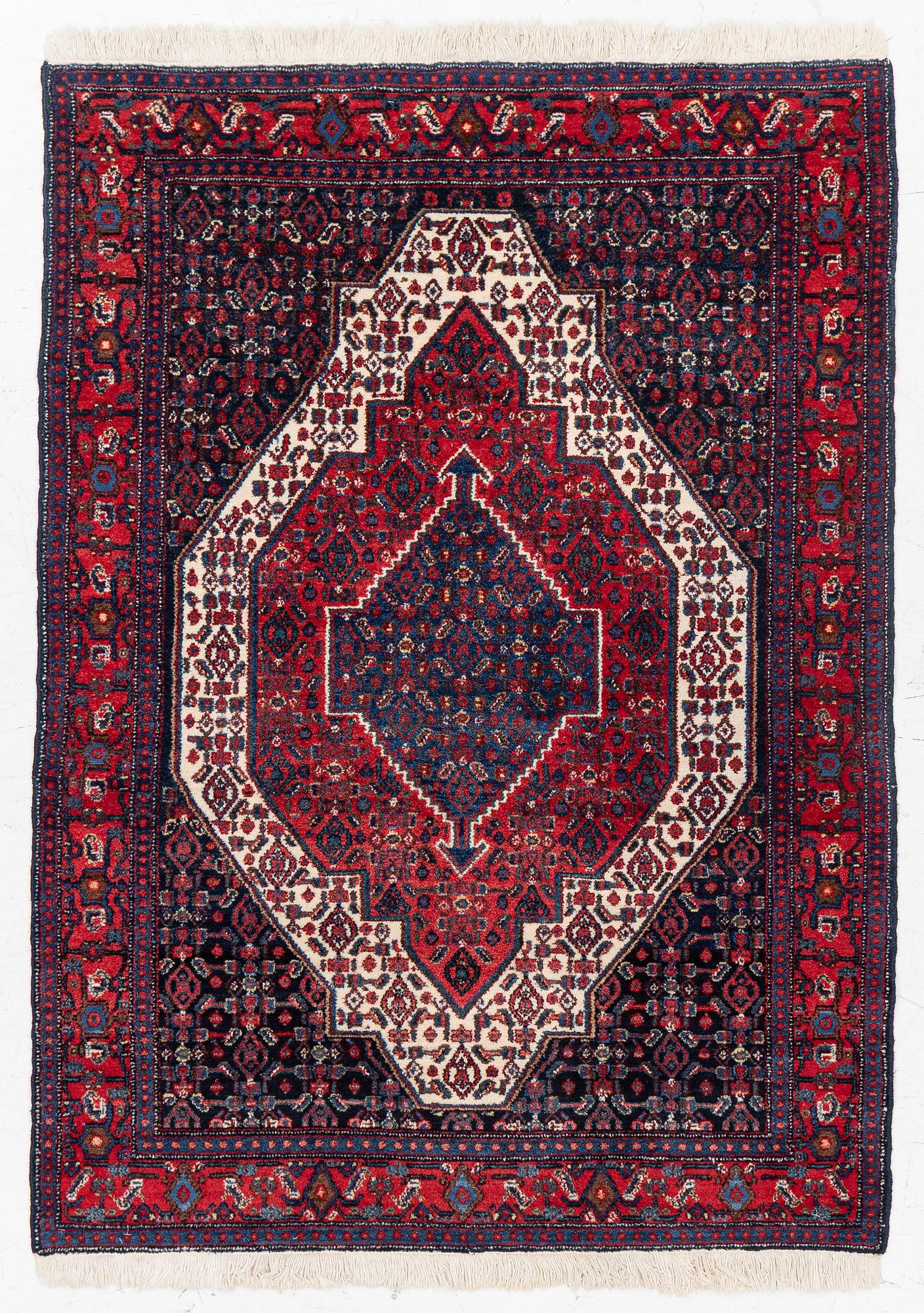 A Senneh rug, c. 160 x 117 cm.