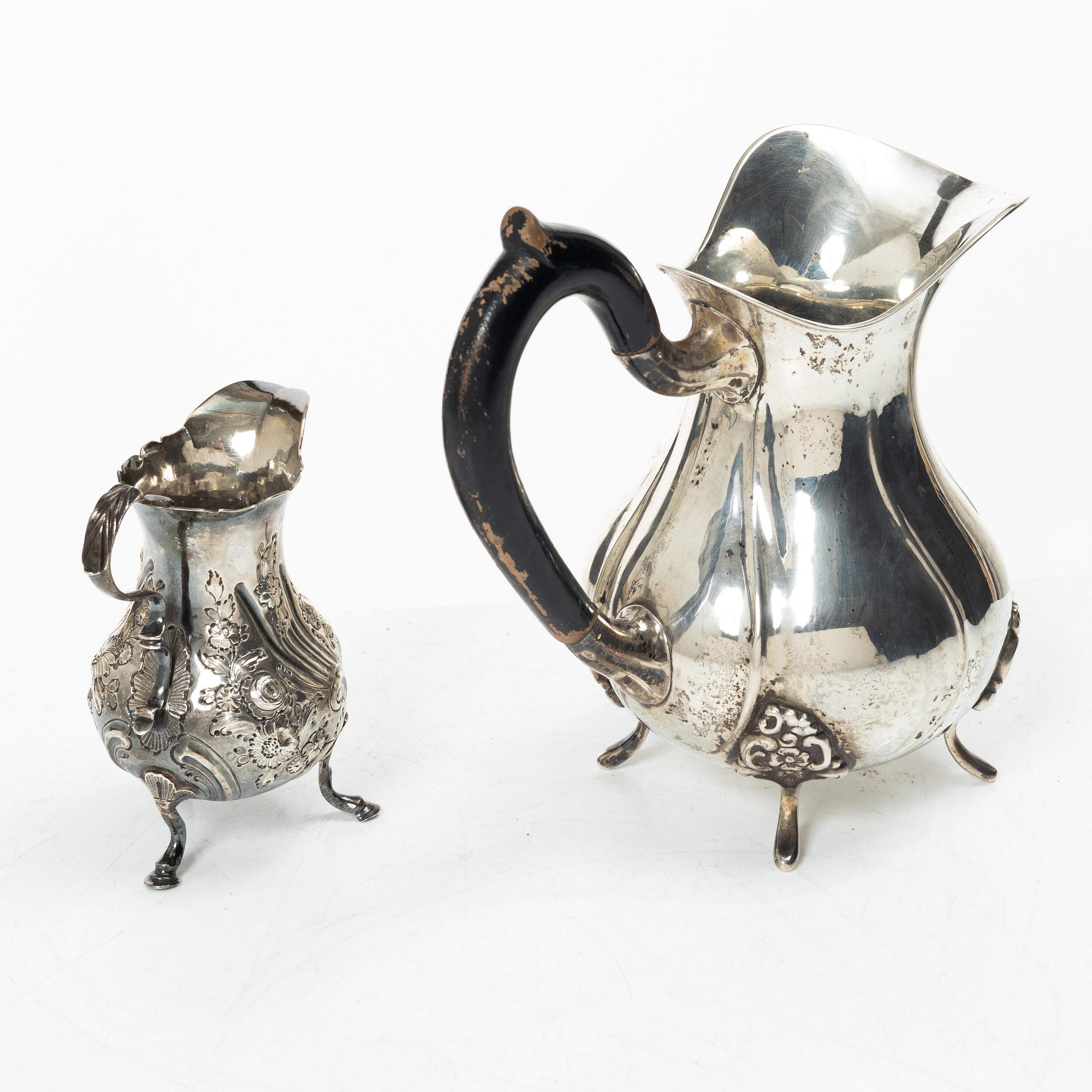 Two silver jugs, one English.