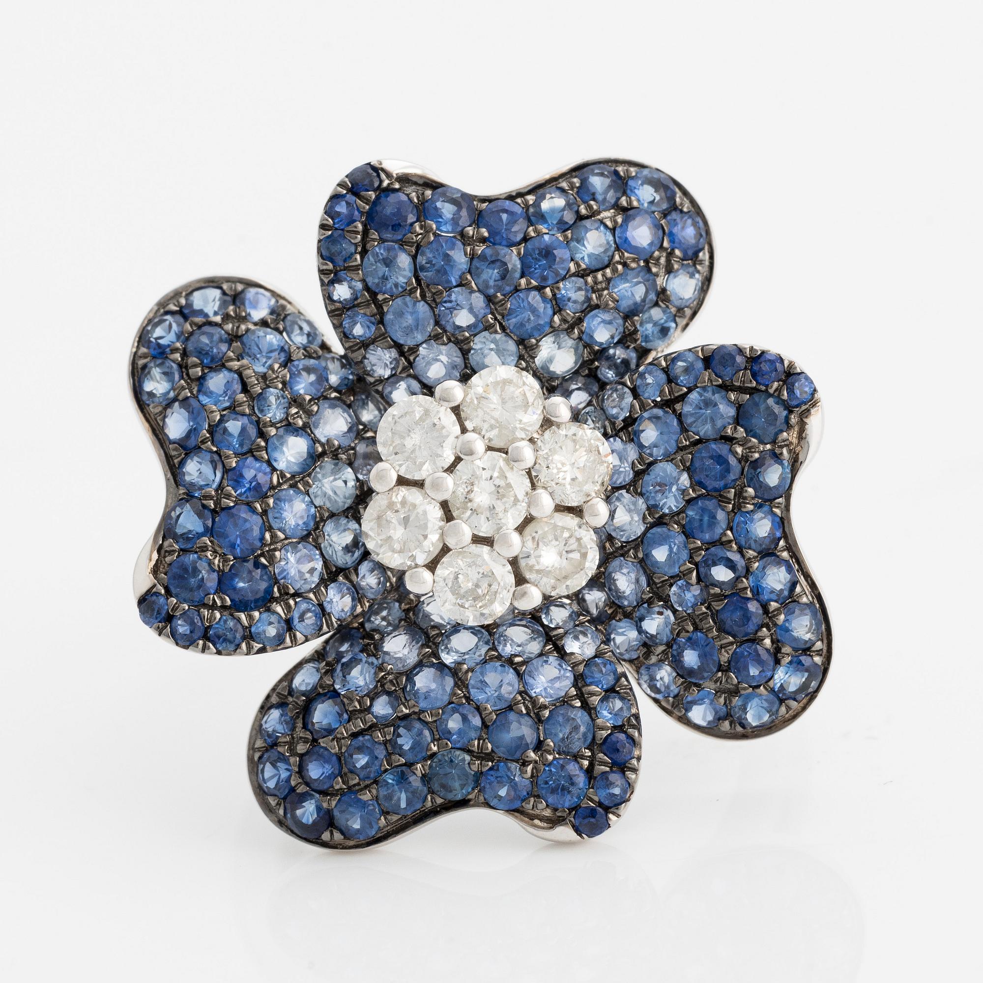 Ring in the shape of a flower with sapphires and brilliant-cut diamonds.