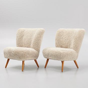 A pair of mid 20th Century easy chairs.