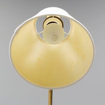 a brass and leather floor lamp from the second half of the 20th century.
