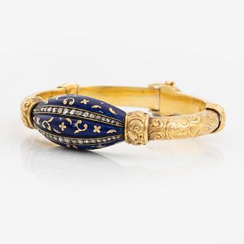 A bangle, gold, blue enamel, and rose cut diamonds.