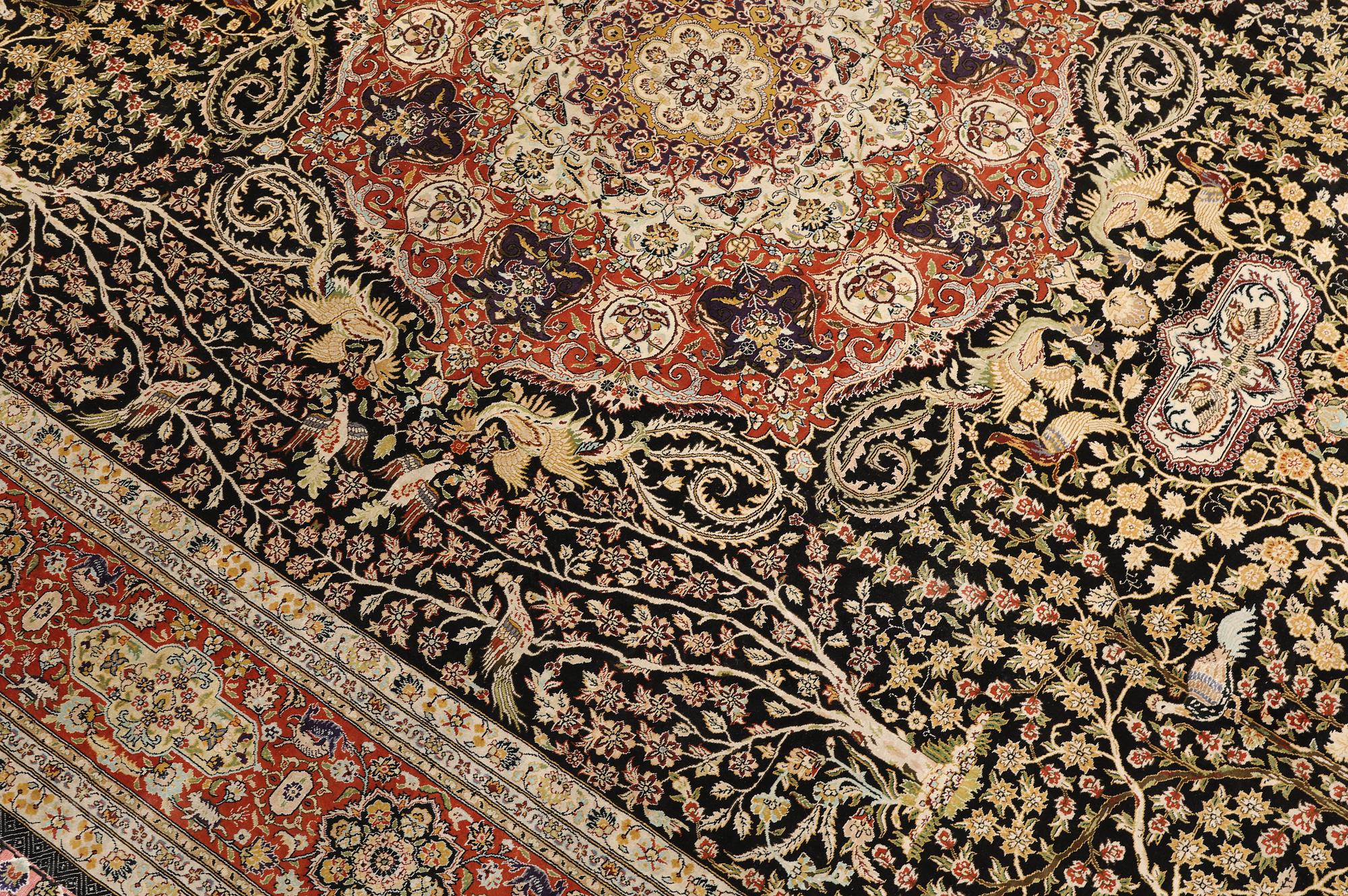 A oriental silk carpet, 303 x 201 cm.