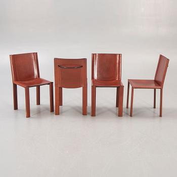A set of four Matteo Grassi leather chairs alter part of the 20th century.