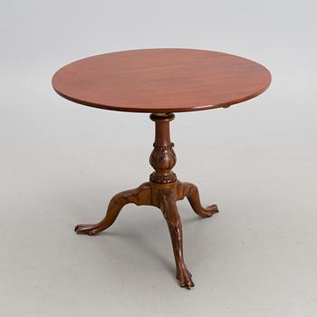 A 18th century mahogany English tilt top table.