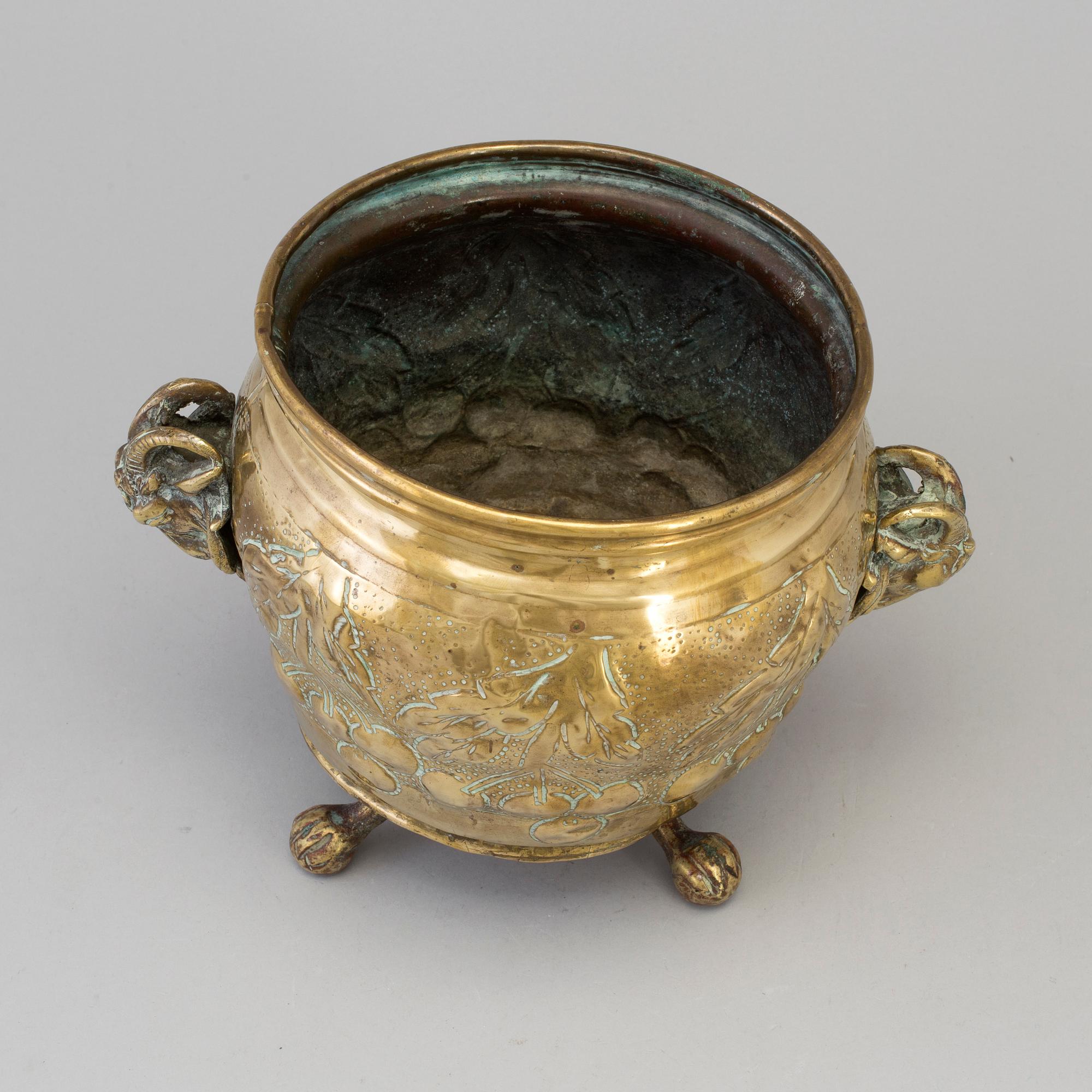 A 19TH CENTURY BRASS FLOWER POT.