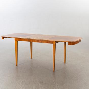 A 1950/60's dining table and chairs.