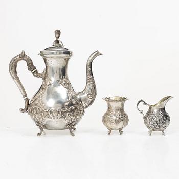 A silver Rococo style coffee pot, creamer and sugar bowl, Swedish import mark of Gewe Silvervarufabriken Ab, Malmö, 1977.