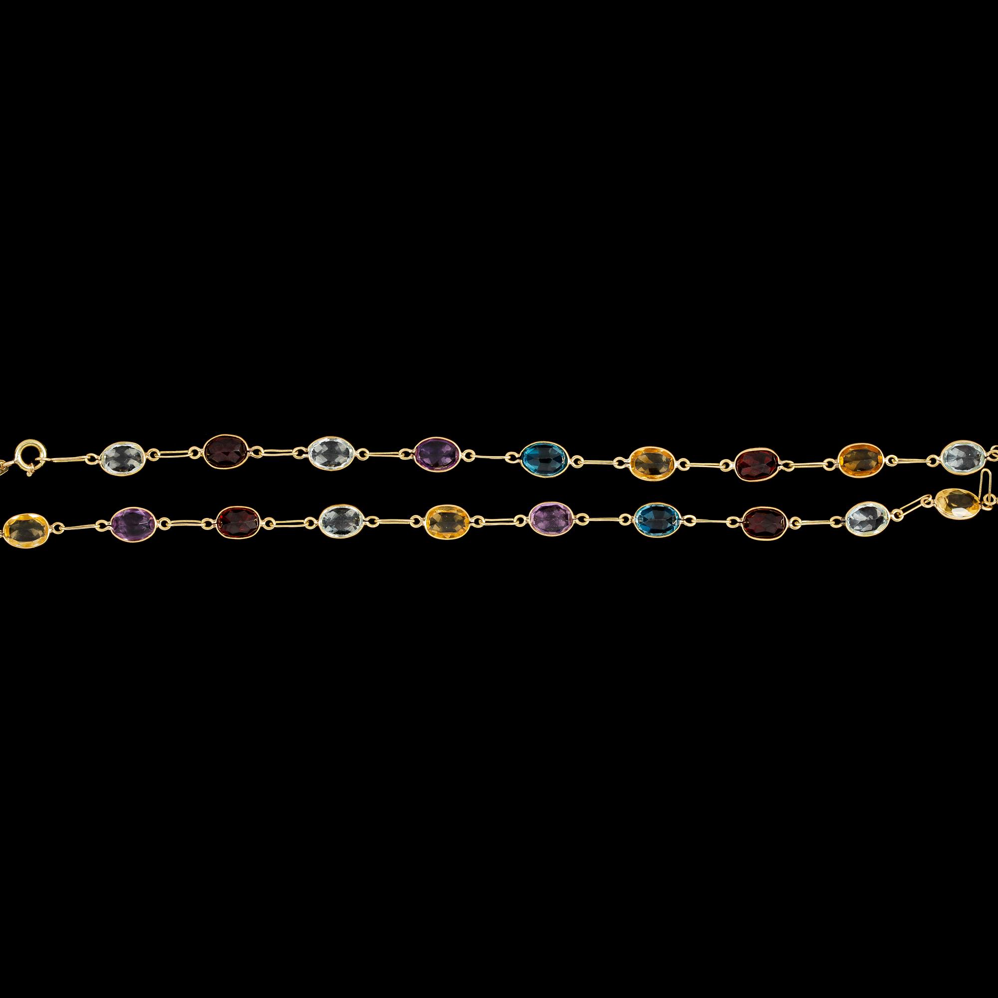 NECKLACE, different faceted coloured gemstones.