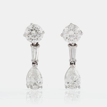 866. A PAIR OF EARRINGS set with diamonds.