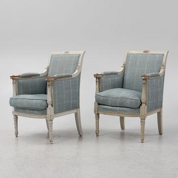 A painted pair of Bergere armchairs, France, 19th Century.