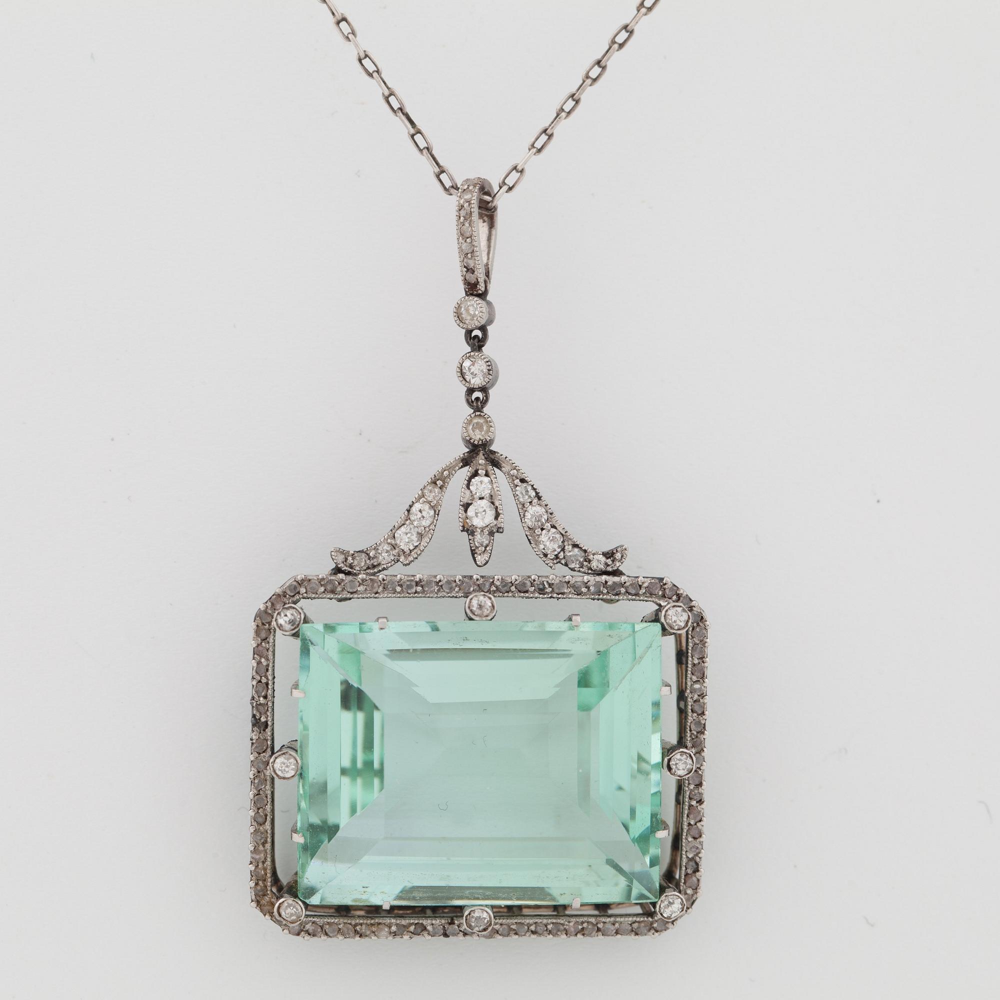 A circa 37.00 ct aquamarine and rose- and old-cut diamond pendant.