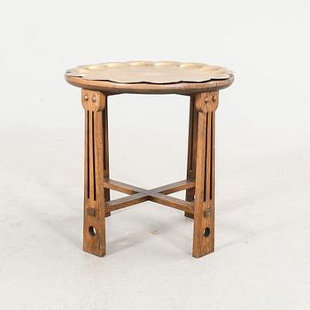 An oak and brass table first half of the 20th century.