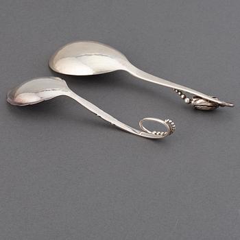 GEORG JENSEN, two sterling  silver serving spoons "Blossom", design no 84 and no 41, Copenhagen post 1945.