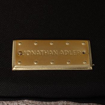 Jonathan Adler, a pair of 'Bacharach Swivel Chairs'.