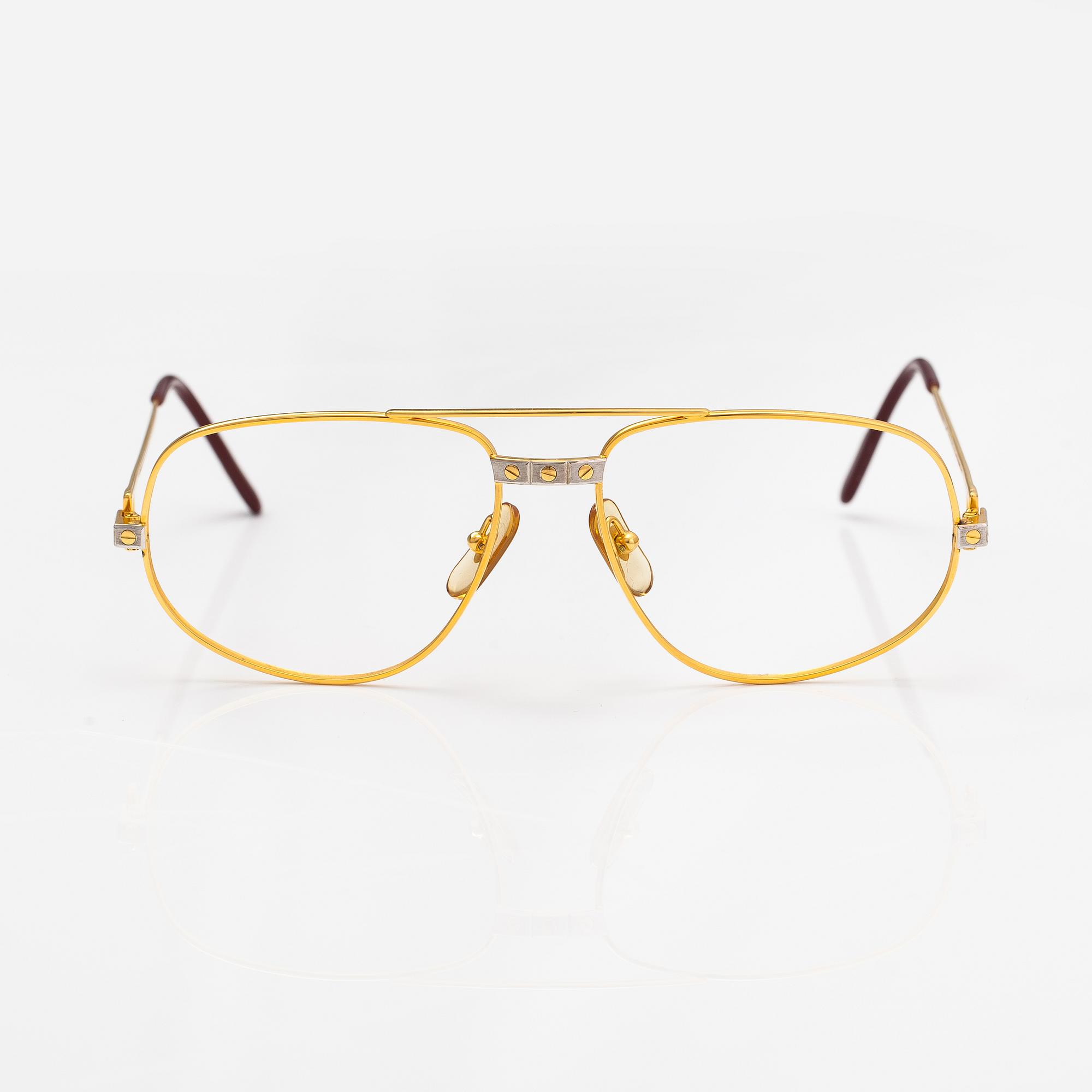 must de Cartier, Santos, a pair of eyeglass frames. Marked Cartier, Paris, Made in France 135, 56, 16.