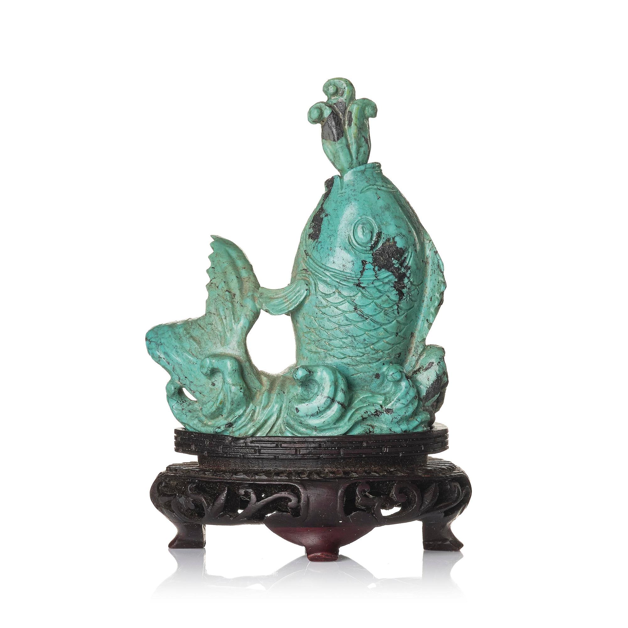 A well sculptured turquoise figure of a carp, Qing dynasty, 19th century.