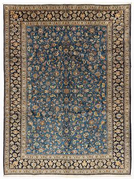 A signed Kashan carpet, ca 402 x 299 cm.