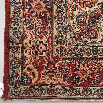 A carpet, an antique Kerman Laver, ca 677-688,5 x 510,5-526 cm.