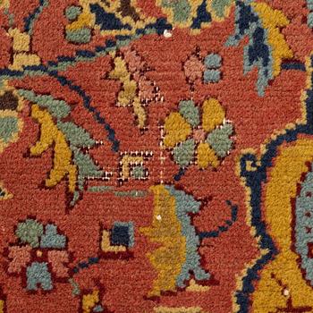 A carpet, antique/semi-antique Turkish/Indian, approx. 330 x 234 cm.