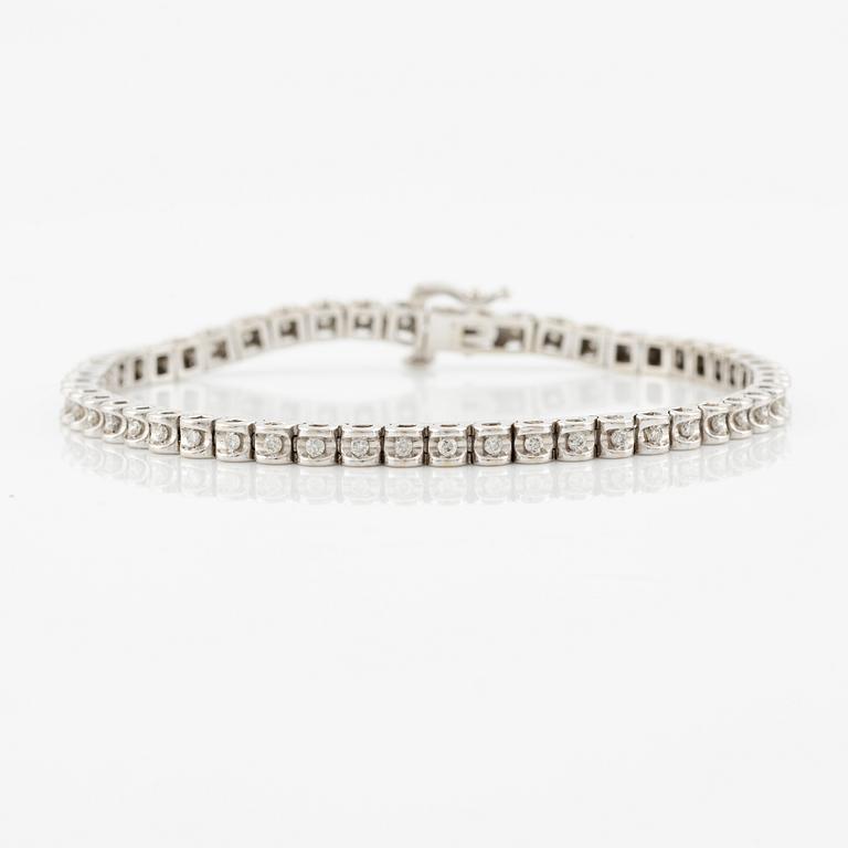 Tennis bracelet, 14K white gold and brilliant-cut diamonds.