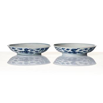 A pair of blue and white 'Phoenix dishes', Qing dynasty with Guangxu six character mark and of the period (1875-1908).