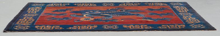 A CARPET, an old Baotou figural, China, ca 162,5 x 233,5 cm.