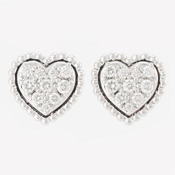 Heart-shaped earrings with brilliant-cut diamonds.