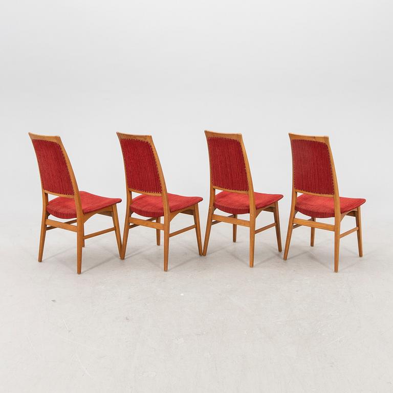 A set of four  mid 1900s teak chairs.