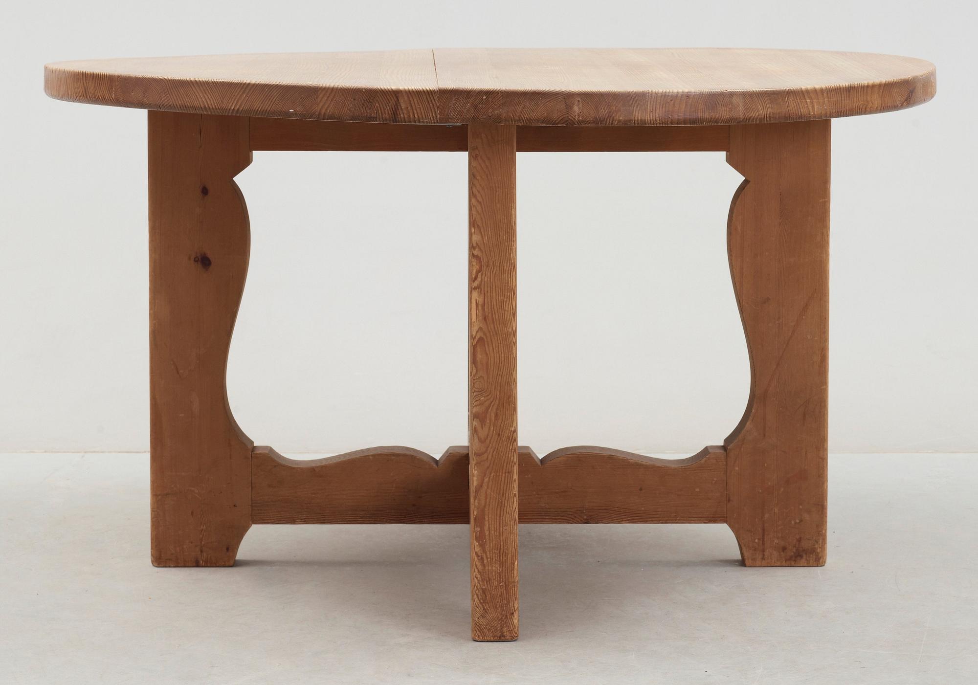 A stained pine dining table, attributed to Axel Einar Hjorth, Nordiska Kompaniet, 1930's.