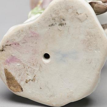 A porcelain figure of a bagpiper, 'Meissen mark'.