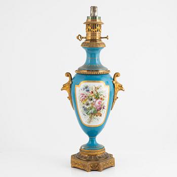 A gilt-brass and porcelaine Louis XVI-style kerosene lamp, later part 19th century.