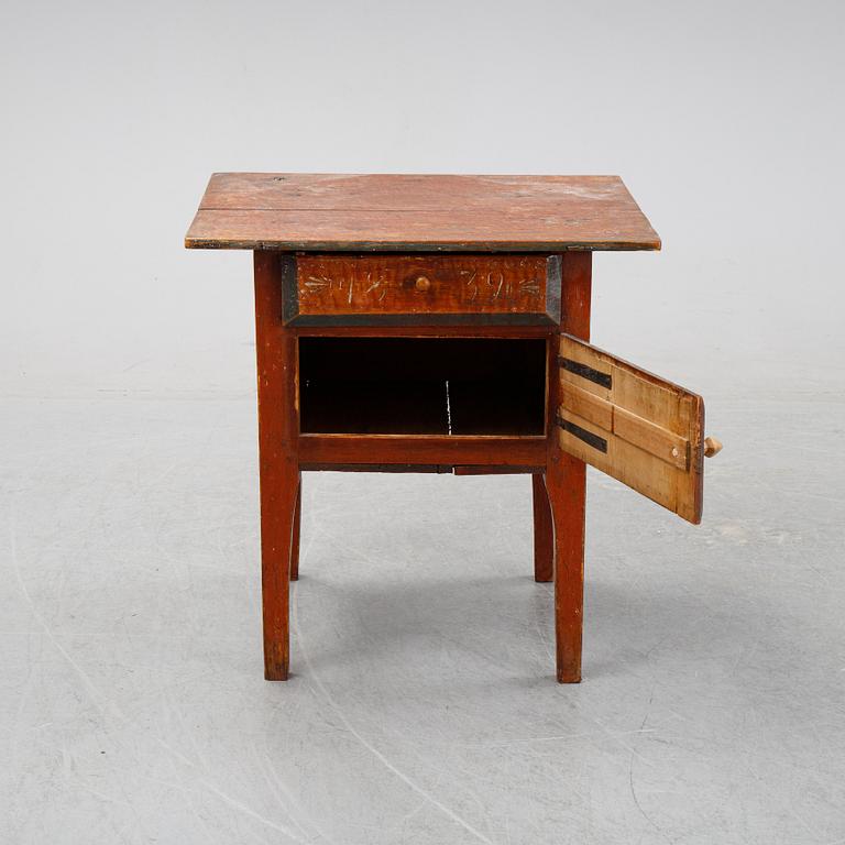 A swedish wooden table from Hälsingland, first half of the 19th century.