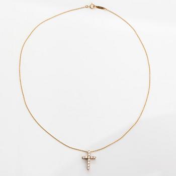 Tiffany & Co, an 18K gold cross pendant necklace with diamonds, ca. 0.42 ct in total.